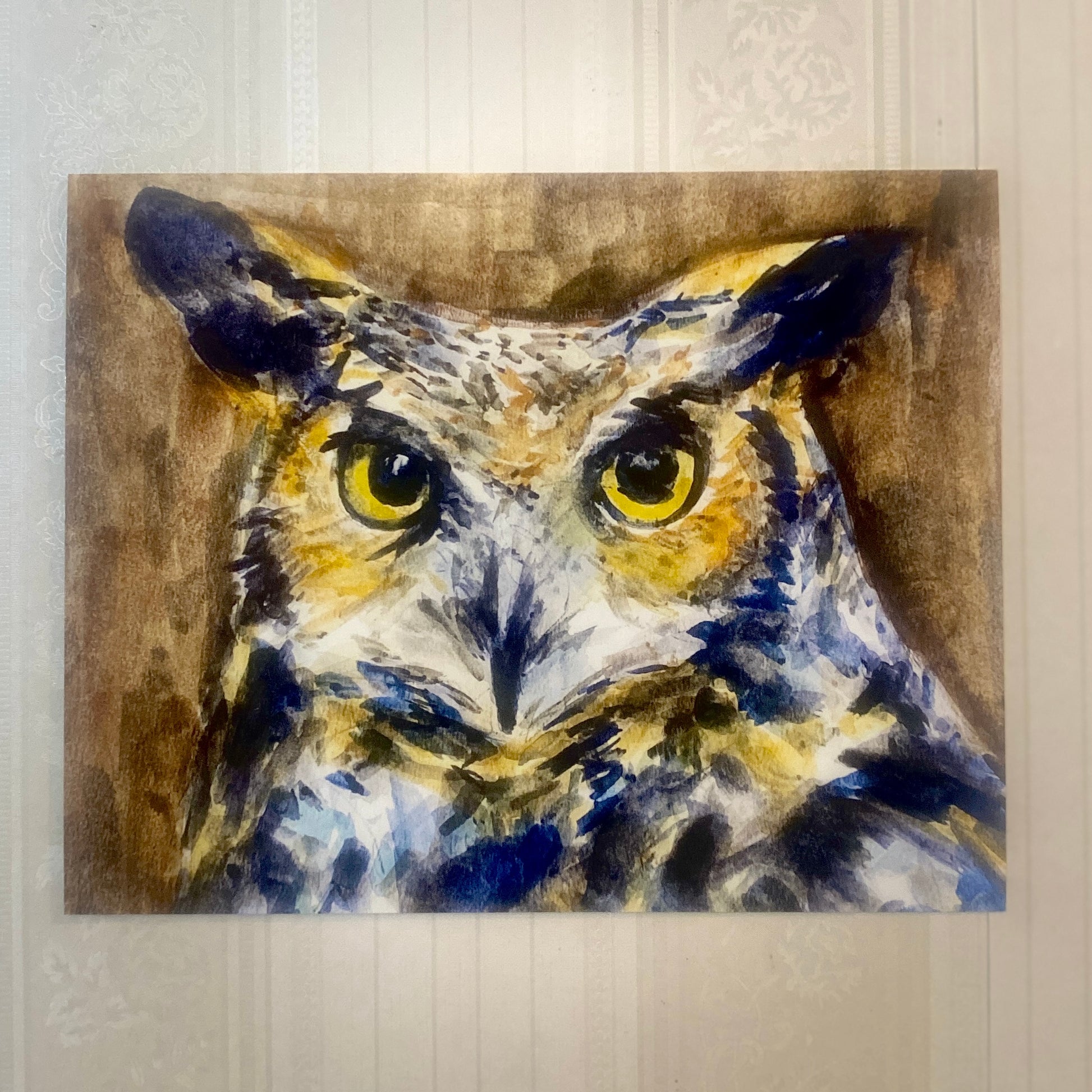 Print of an owl on a textured wall